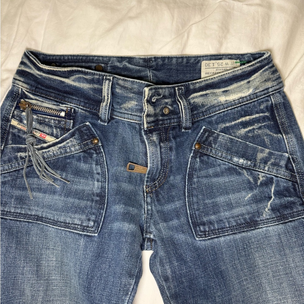 Diesel Blue Jeans with Gold Stitching and Distressed Look
